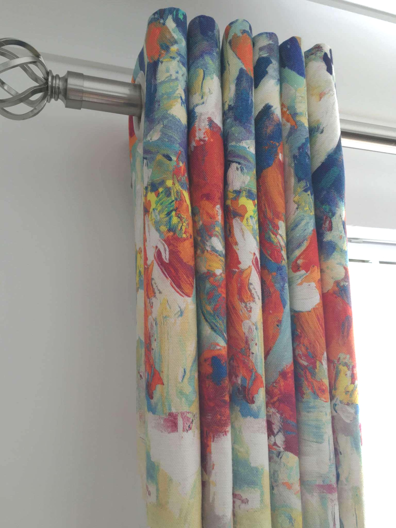 Close detail of a finished eyelet curtain heading